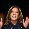 Kamala Harris delivering a speech, inspiring hope and ambition with her "Anything is Possible" message.