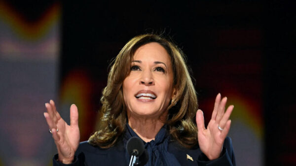 Kamala Harris delivering a speech, inspiring hope and ambition with her "Anything is Possible" message.