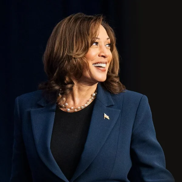 Kamala Harris speaking passionately during a campaign event, embodying progress and forward-thinking leadership.