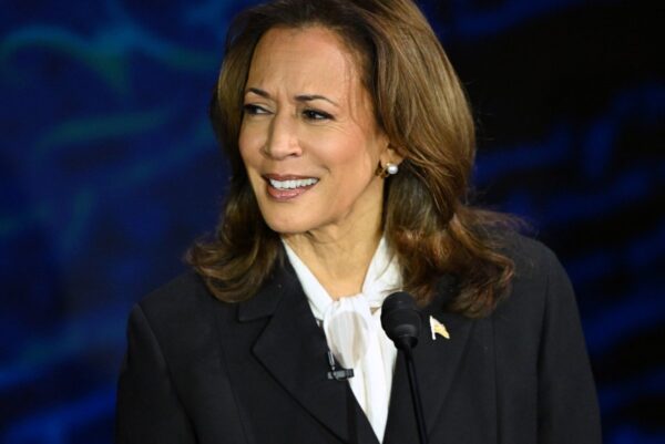 Kamala Harris speaking during the debate, showcasing her leadership and passion for justice.